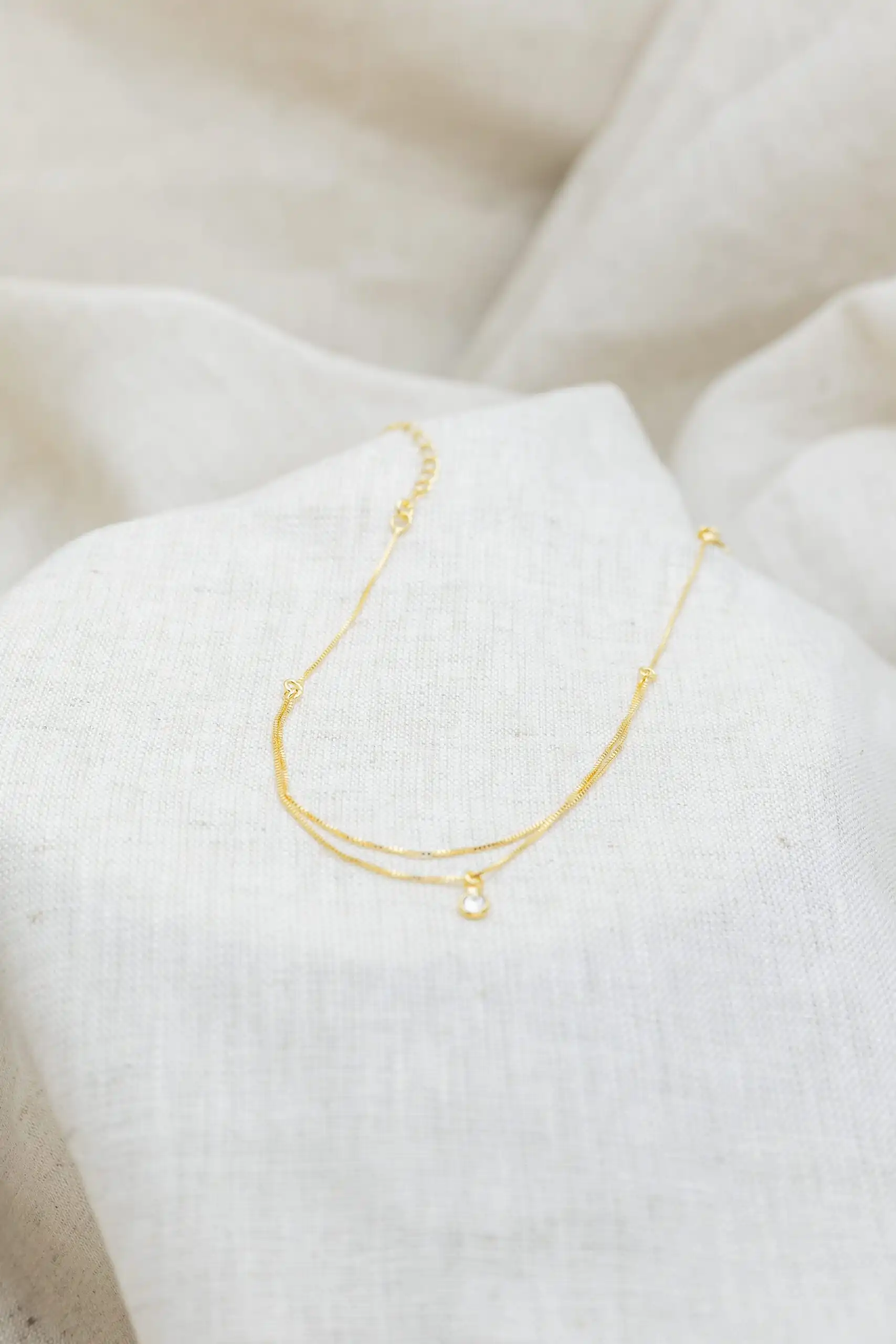 Tornozeleira com Ponto de Luz Banhada em Ouro 18k